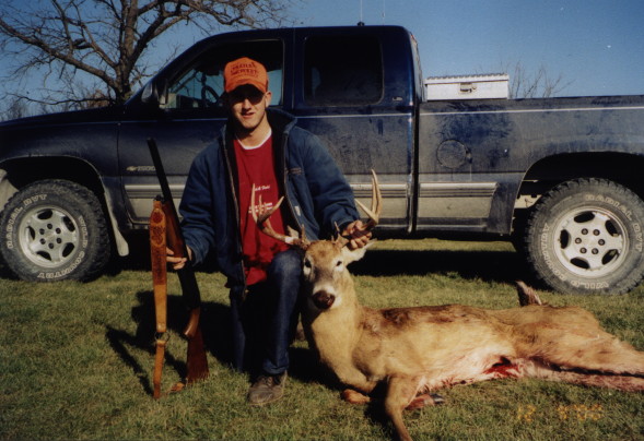 Josh's Buck with a shot gun in 2000